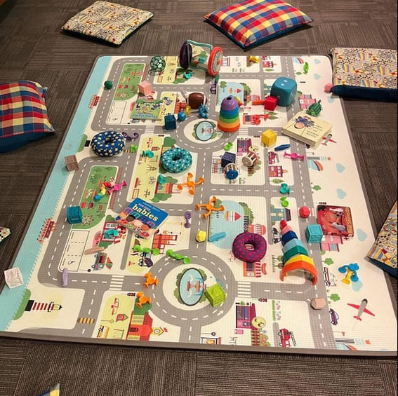 Play mat covered in baby toys